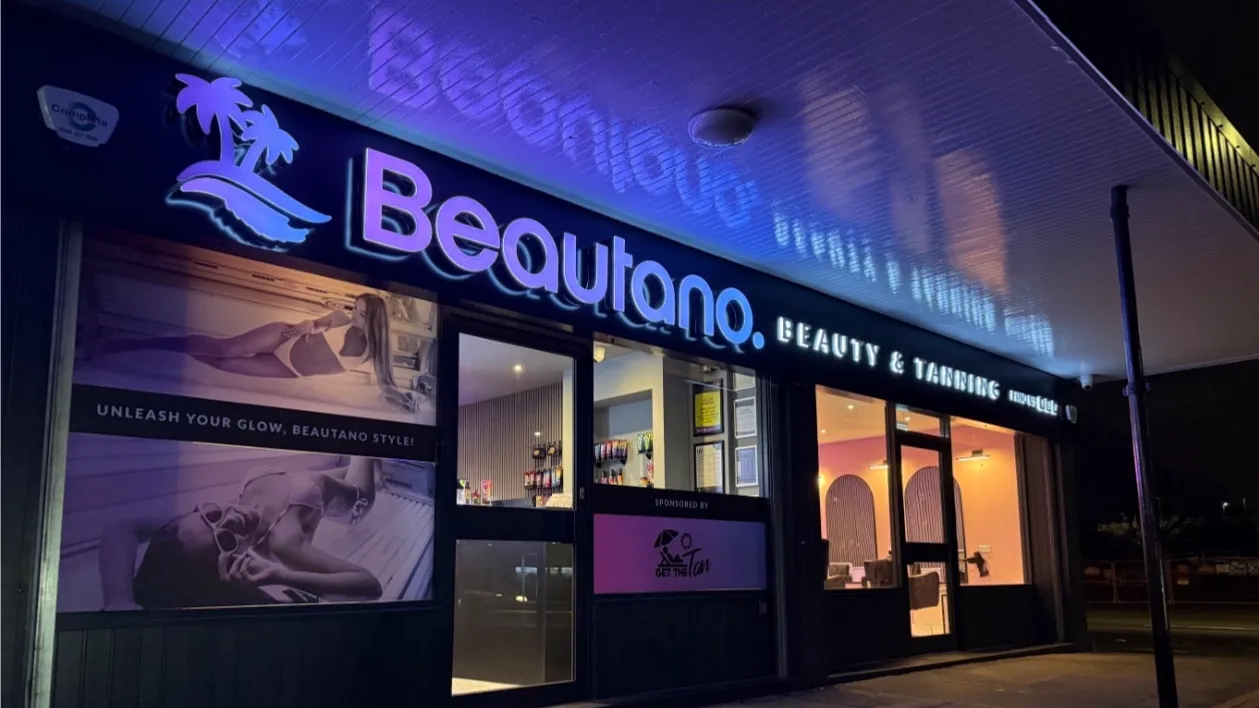 Beautano storefront at night, lit up in Nitshill, Glasgow