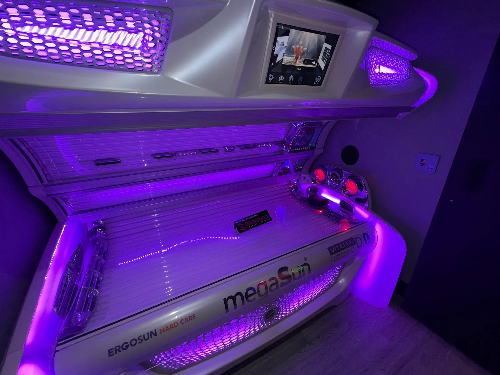 A megaSun bed glowing purple inside Beautano